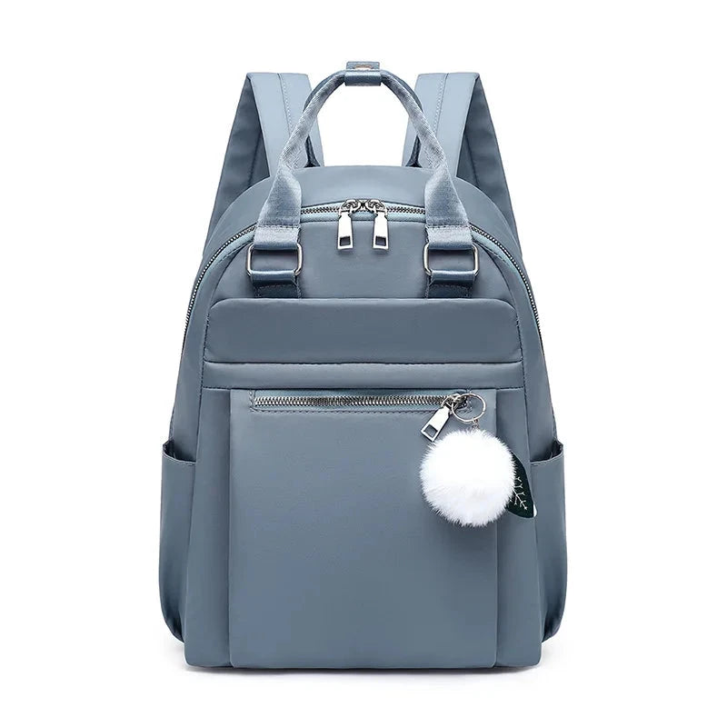 mochila feminina pompom