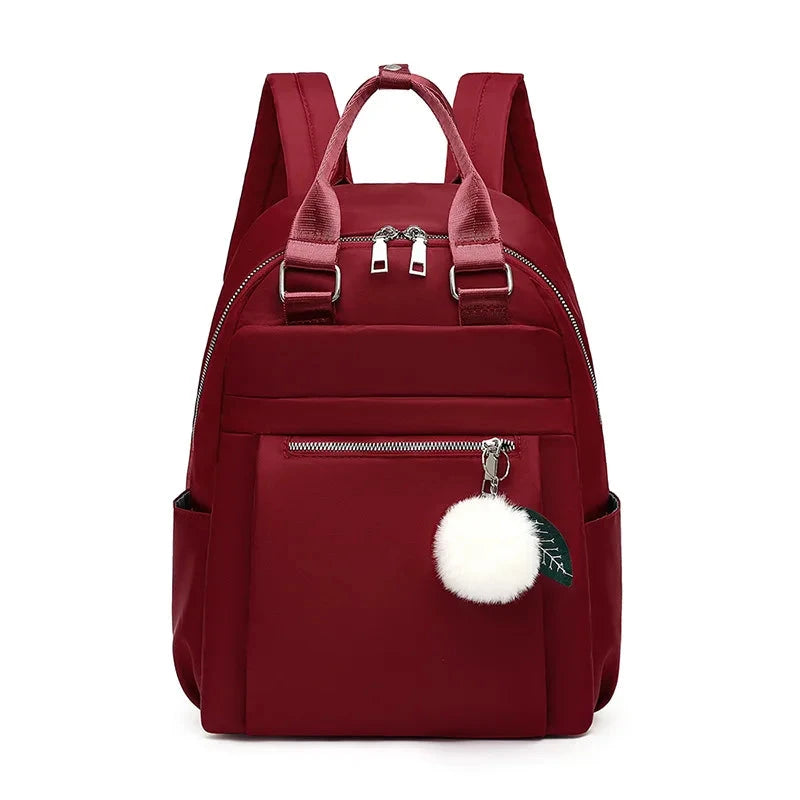 mochila senhora pompom 
